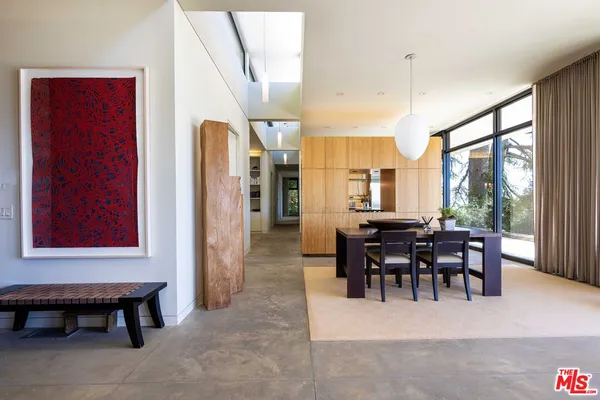 a kitchen with stainless steel appliances granite countertop a sink a stove and refrigerator