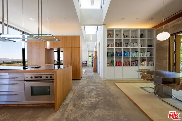 a terrace with outdoor seating and city view