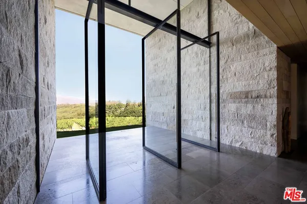 a bathroom with a large tub and shower