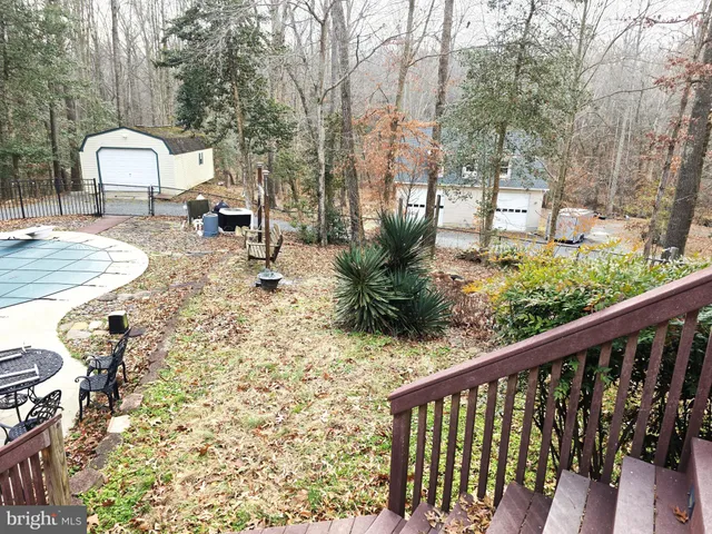 a view of a house with a wooden deck