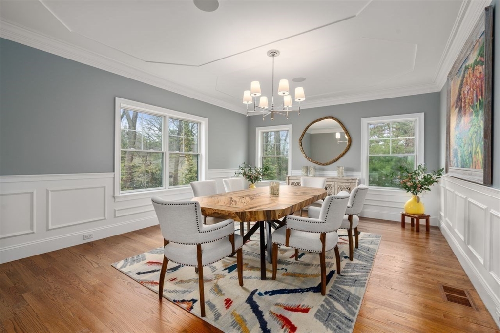56 Blossomcrest Road Lexington, MA 02421 - Photo 6 of 29 a view of a dining room with furniture a chandelier and wooden floor