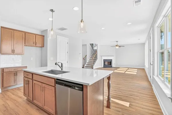 a kitchen with a sink stove and refrigerator