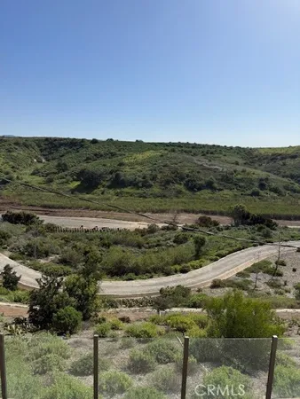 a view of a town with mountains in the background