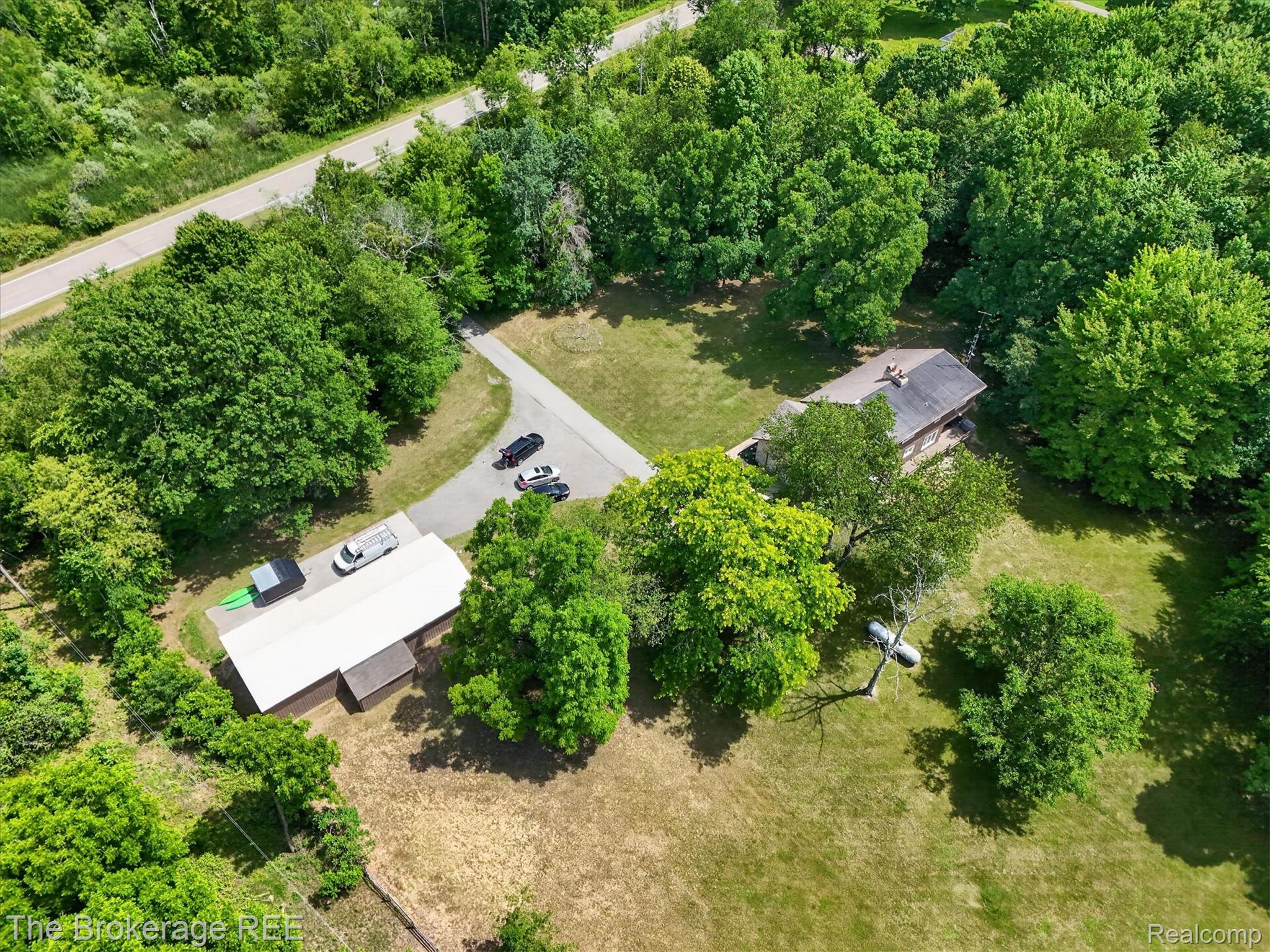 13269 North Genesee Road Clio, MI 48420 - Photo 56 of 67 Aerial perspective showcasing a property surrounded by mature trees