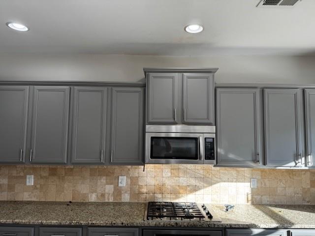1440 A Waverly Glen Drive Alpharetta, GA 30004 - Photo 12 of 28 a kitchen with granite countertop a stove and a microwave with granite countertops