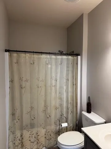 a bathroom with a sink and toilet