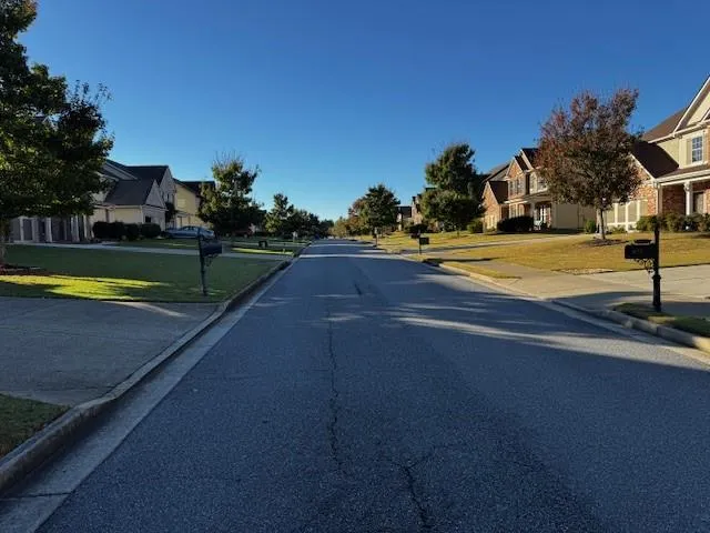 a view of a swimming pool with a yard