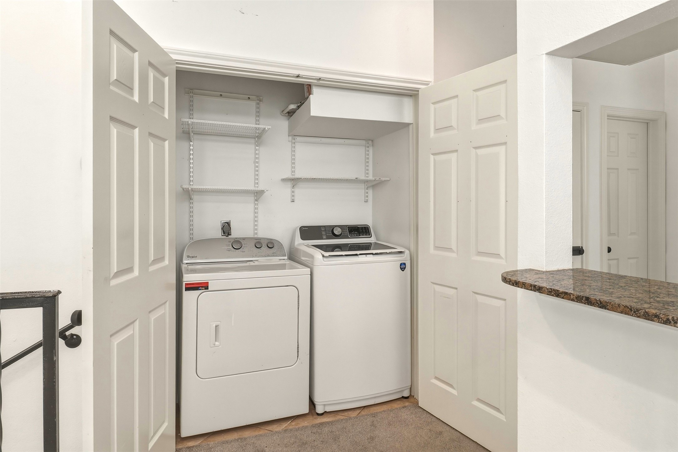 2918 Ranch Road 620, Unit 265 Austin, TX 78734 - Photo 13 of 40 A dedicated laundry space, equipped with modern appliances and functional shelving, ensures convenience and organization.