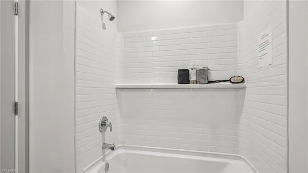 a bathroom with a granite countertop sink and mirror