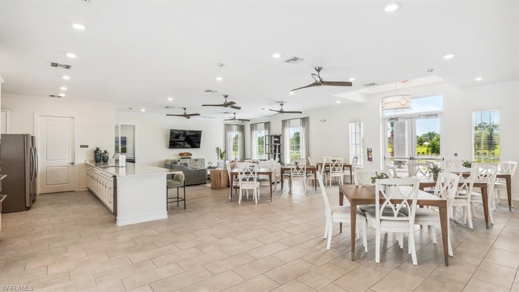 17625 Shade Tree Loop Babcock Ranch, FL 33982 - Photo 25 of 34 a view of a dining area with chandelier