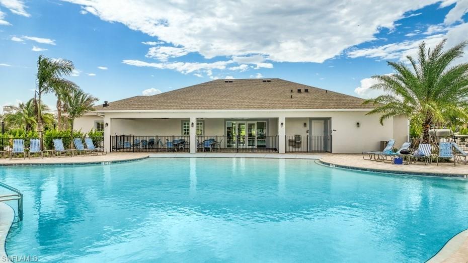 17625 Shade Tree Loop Babcock Ranch, FL 33982 - Photo 32 of 34 a view of a house with swimming pool and a yard