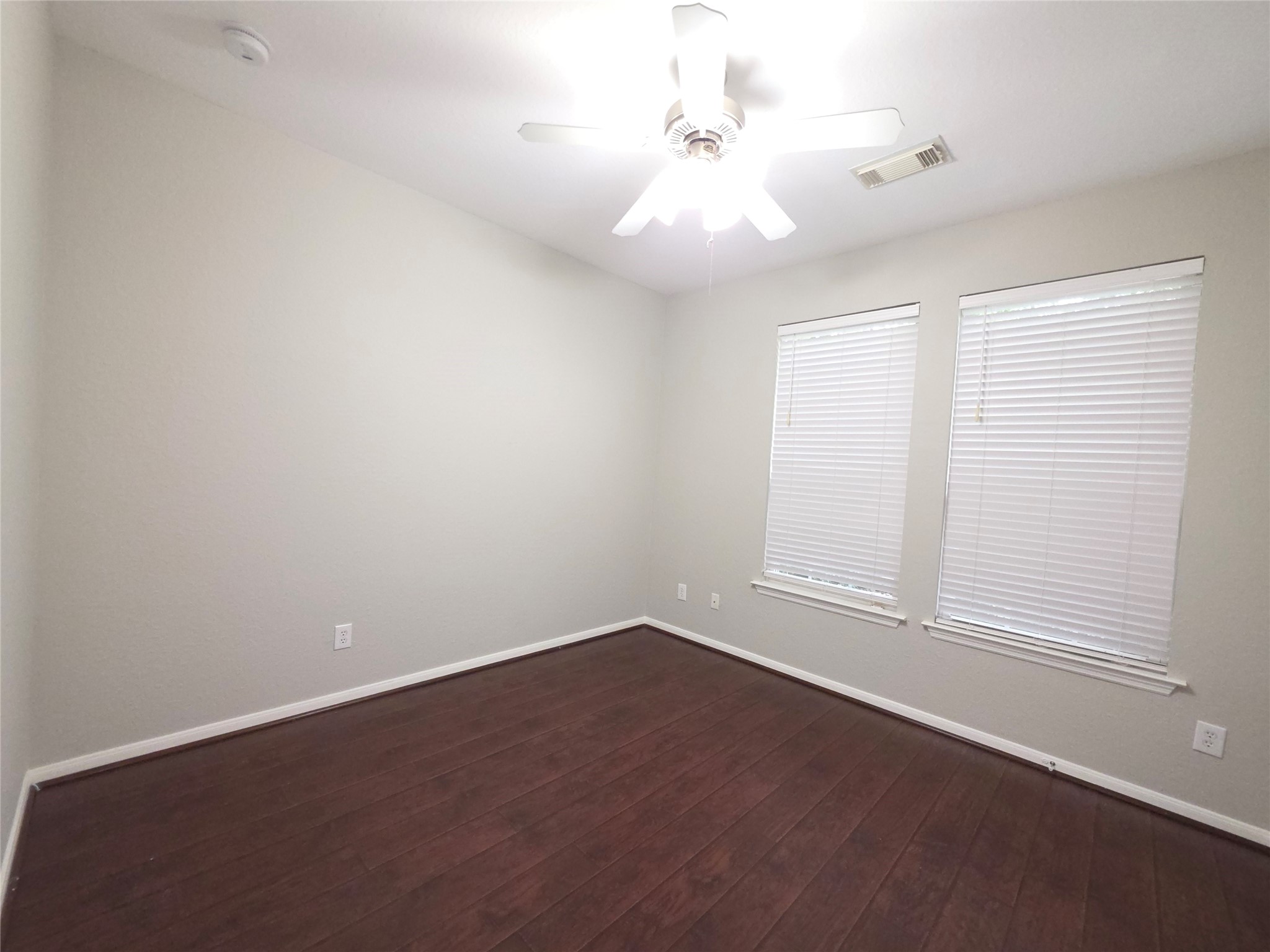 9603 Edgeloch Drive Spring, TX 77379 - Photo 11 of 16 wooden floor in an empty room with a window