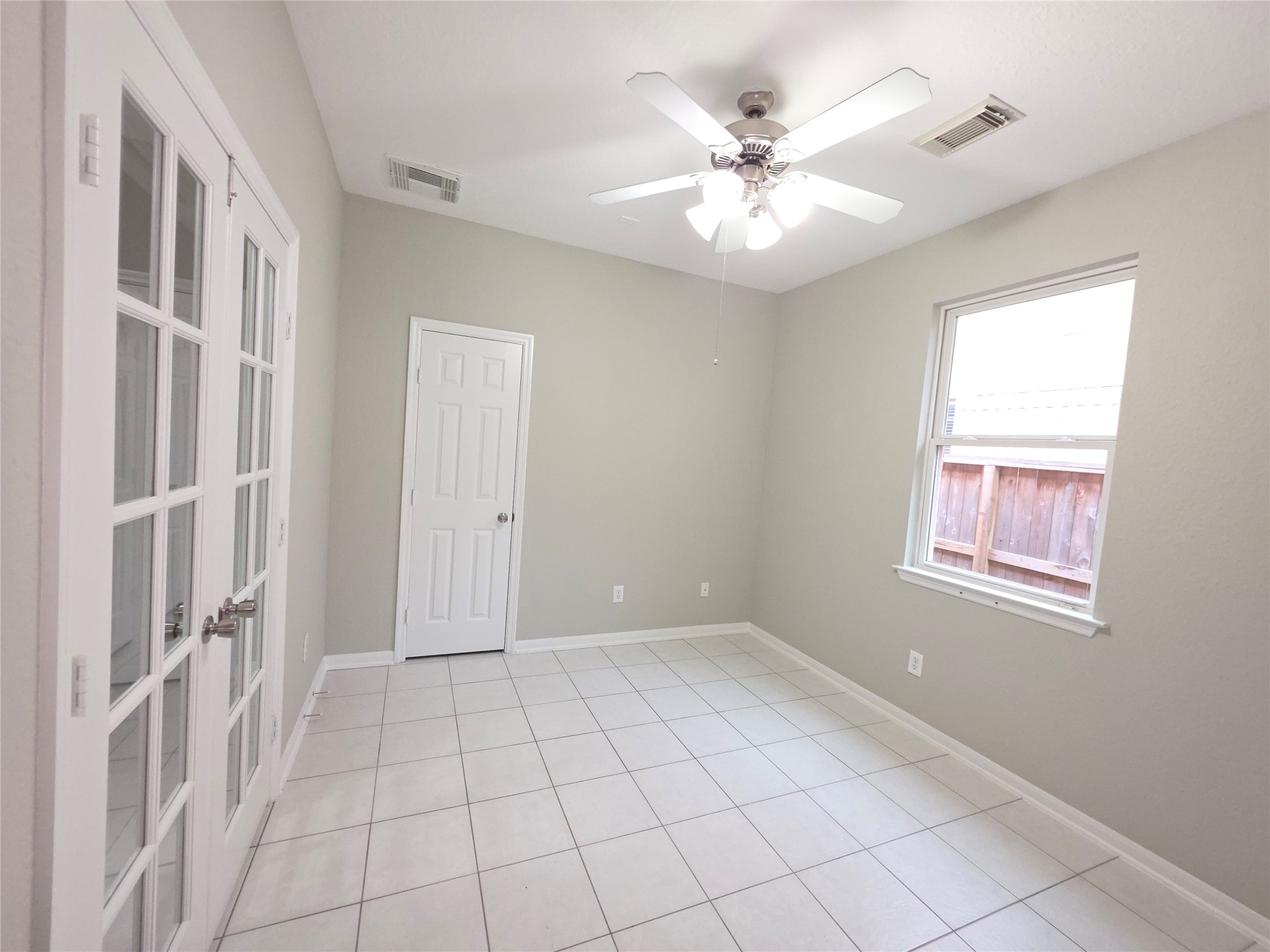 9603 Edgeloch Drive Spring, TX 77379 - Photo 13 of 16 a view of an empty room with chandelier fan