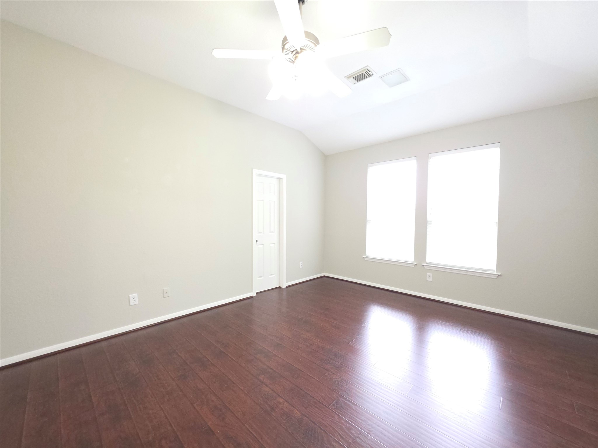 9603 Edgeloch Drive Spring, TX 77379 - Photo 6 of 16 an empty room with wooden floor and windows