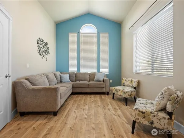a living room with furniture and a large window