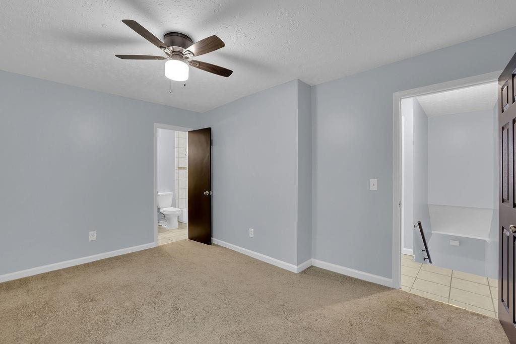 1424 Springleaf Circle Southeast Smyrna, GA 30080 - Photo 29 of 38 an empty room with closet and ceiling fan