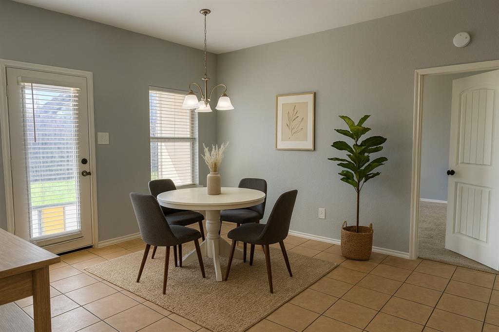 2047 Jack County Drive Forney, TX 75126 - Photo 7 of 20 a view of a dining room with furniture and a potted plant