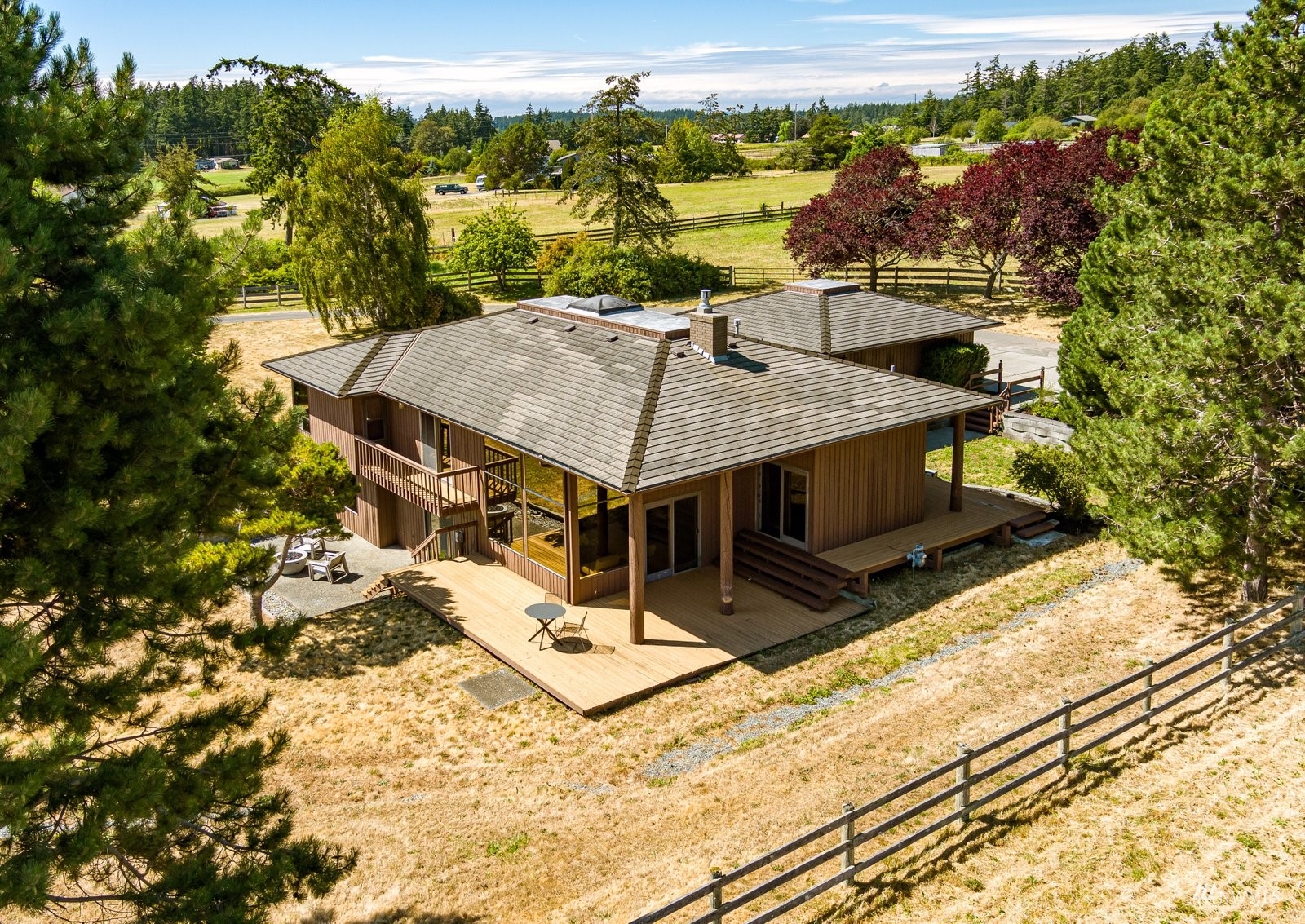 a view of a house with a yard from a balcony