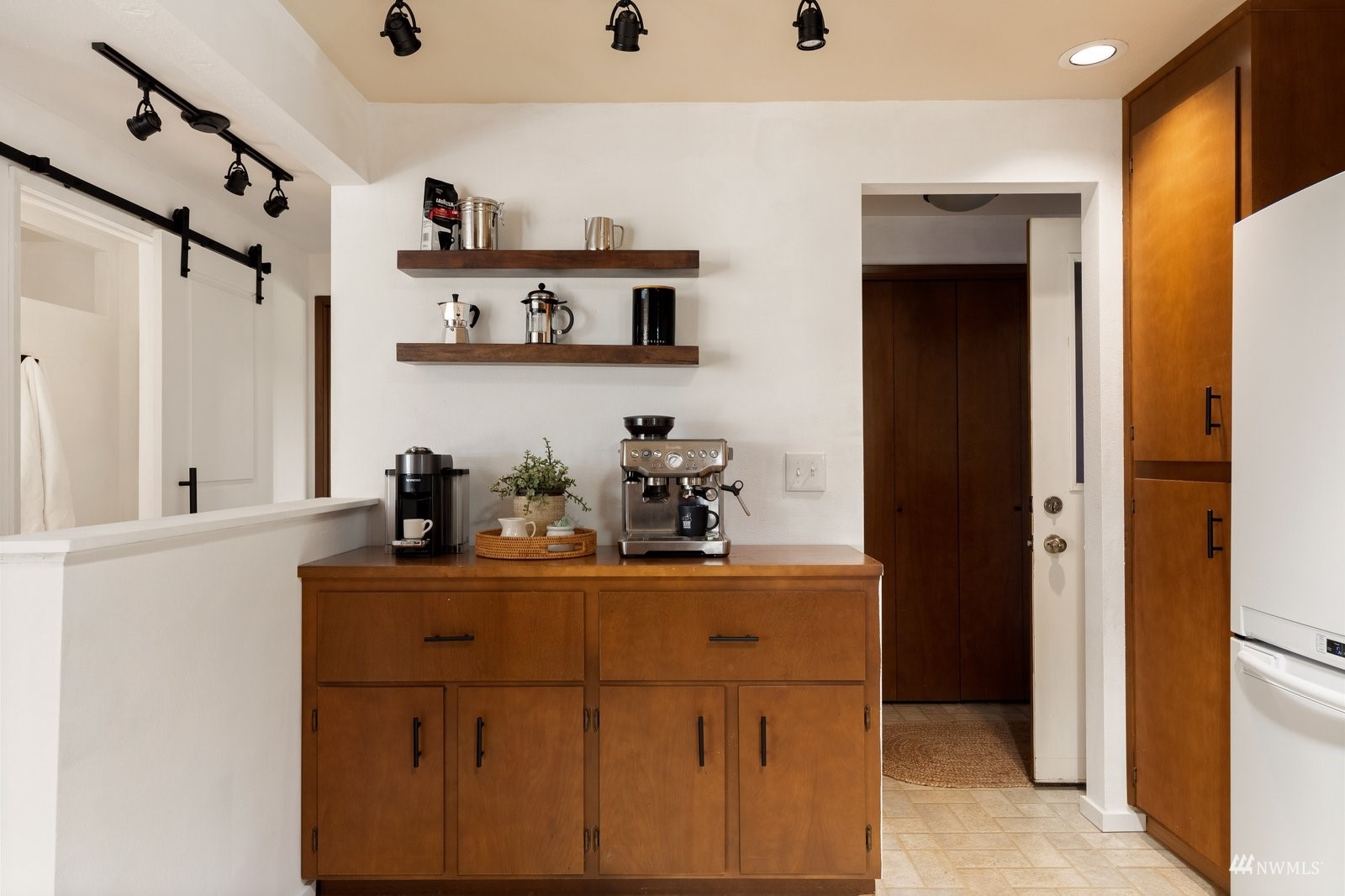 495 East Crescent Harbor Road Oak Harbor, WA 98277 - Photo 11 of 40 a kitchen with stainless steel appliances a sink and cabinets