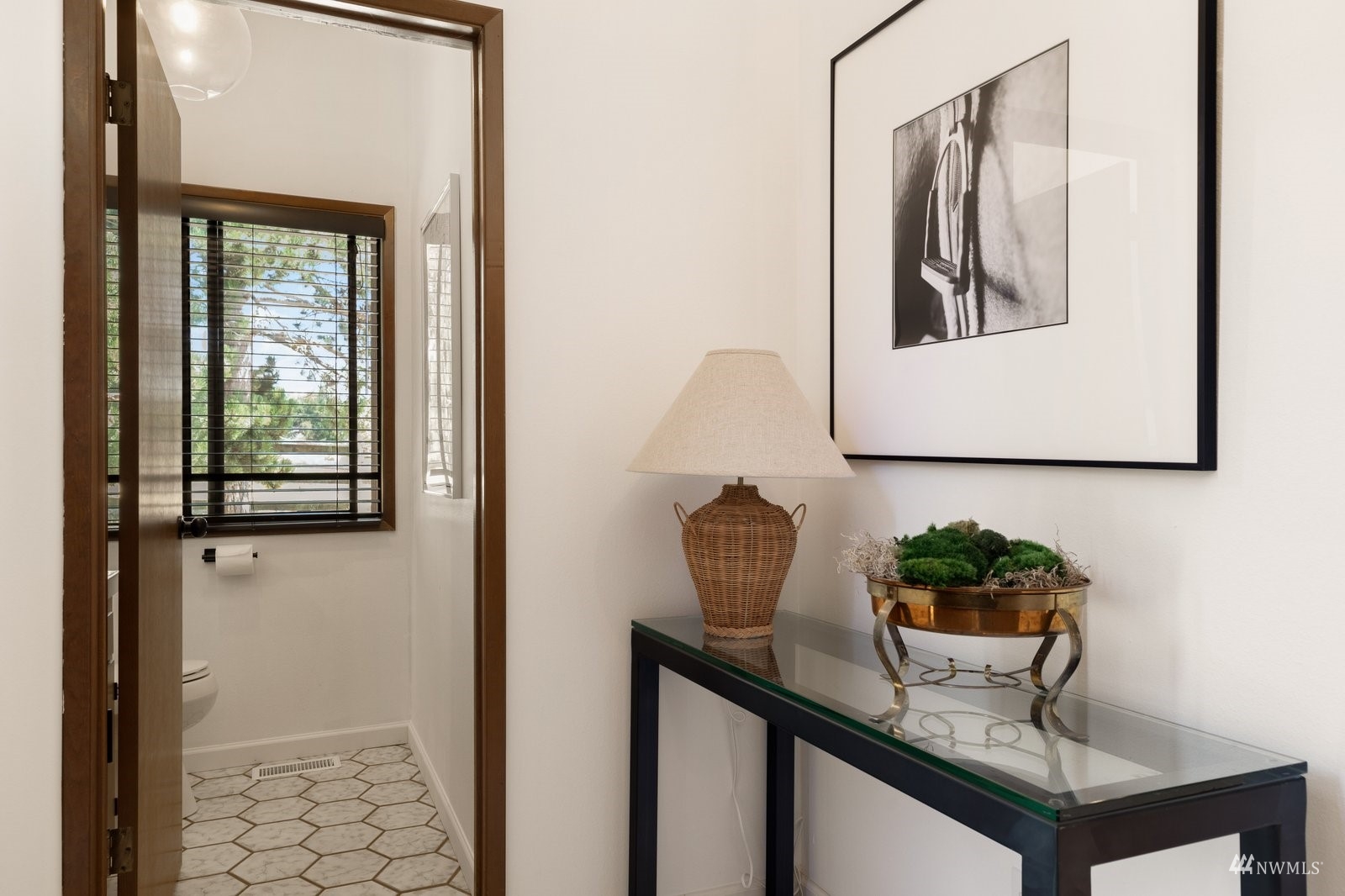 495 East Crescent Harbor Road Oak Harbor, WA 98277 - Photo 15 of 40 a potted plant sitting on top of a shelf