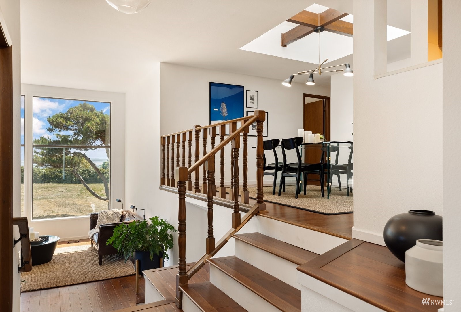 495 East Crescent Harbor Road Oak Harbor, WA 98277 - Photo 16 of 40 a living room with furniture and a potted plant