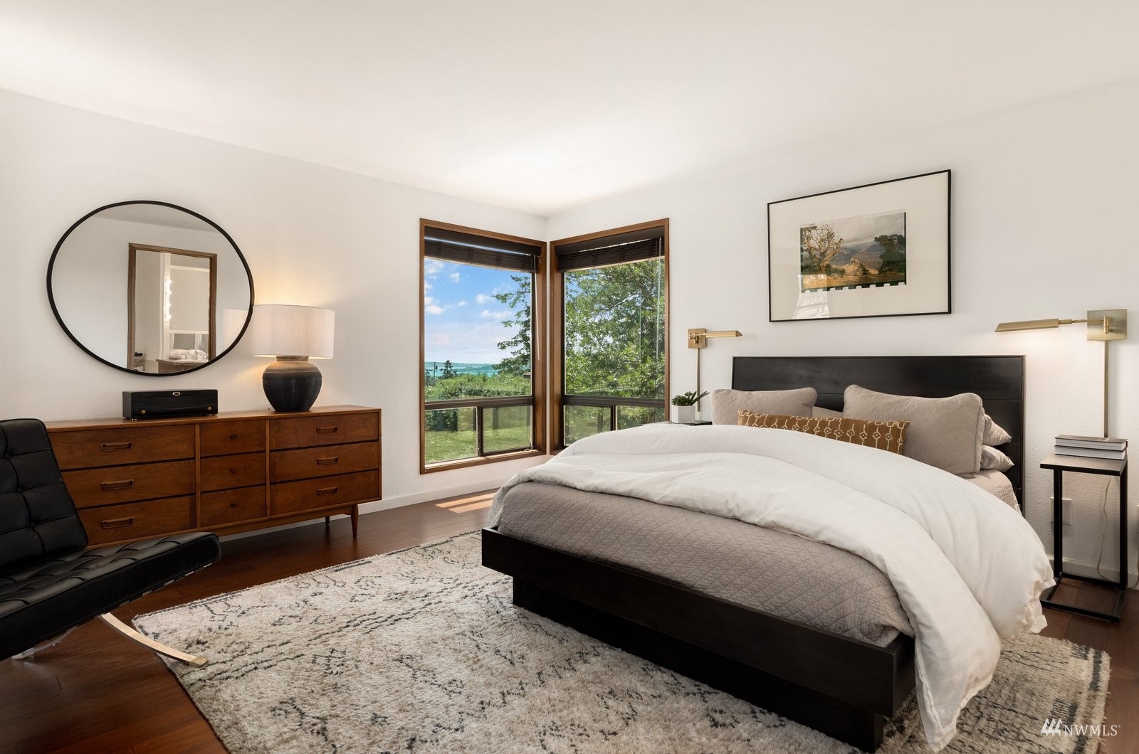 495 East Crescent Harbor Road Oak Harbor, WA 98277 - Photo 19 of 40 a bed room with a bed a mirror and a window