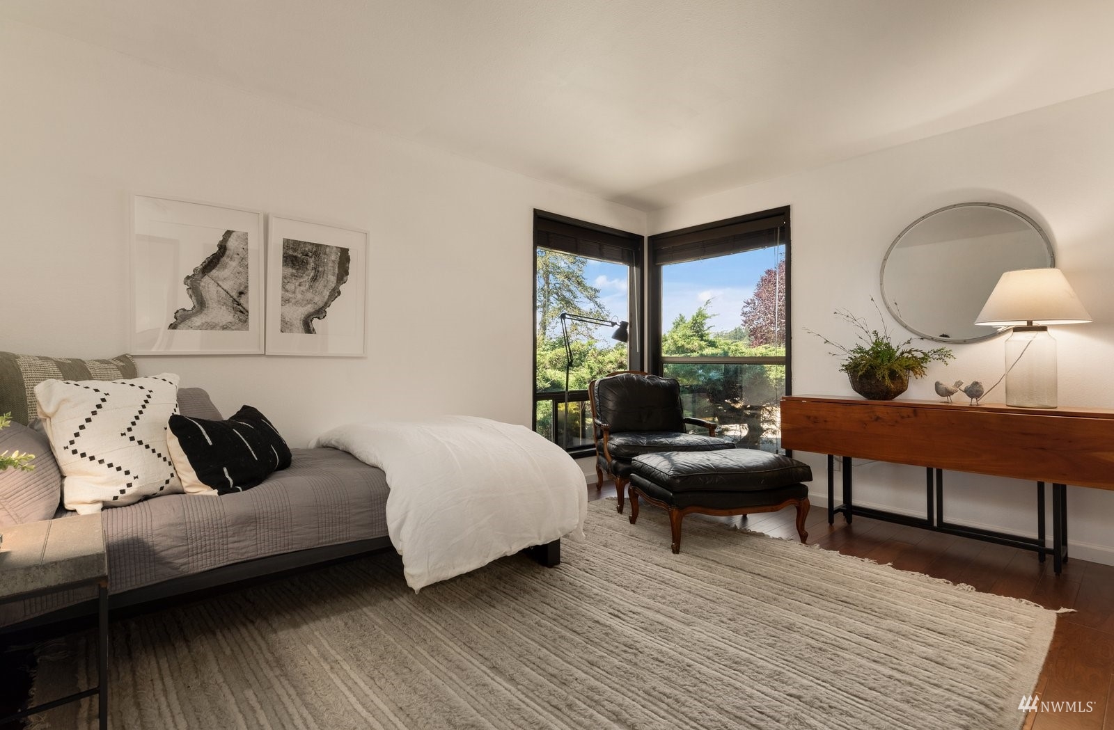 495 East Crescent Harbor Road Oak Harbor, WA 98277 - Photo 26 of 40 a living room with furniture and a wooden floor