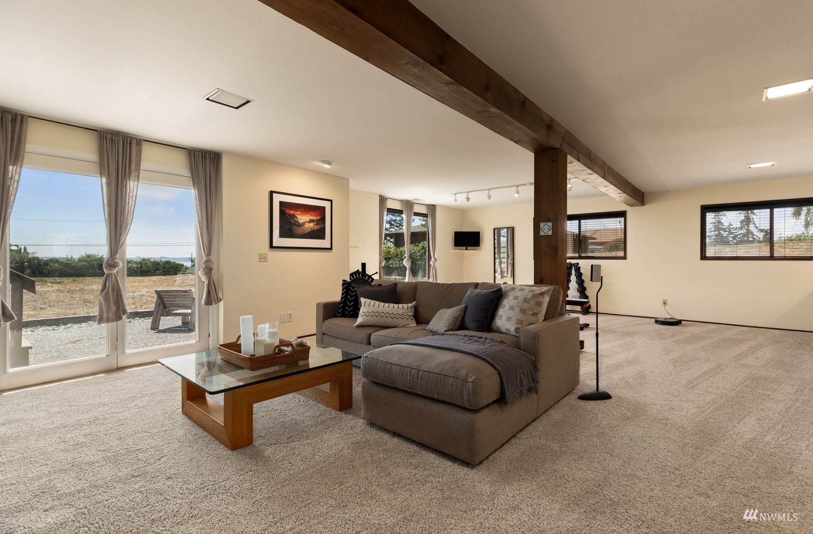 495 East Crescent Harbor Road Oak Harbor, WA 98277 - Photo 27 of 40 a living room with furniture and a large window