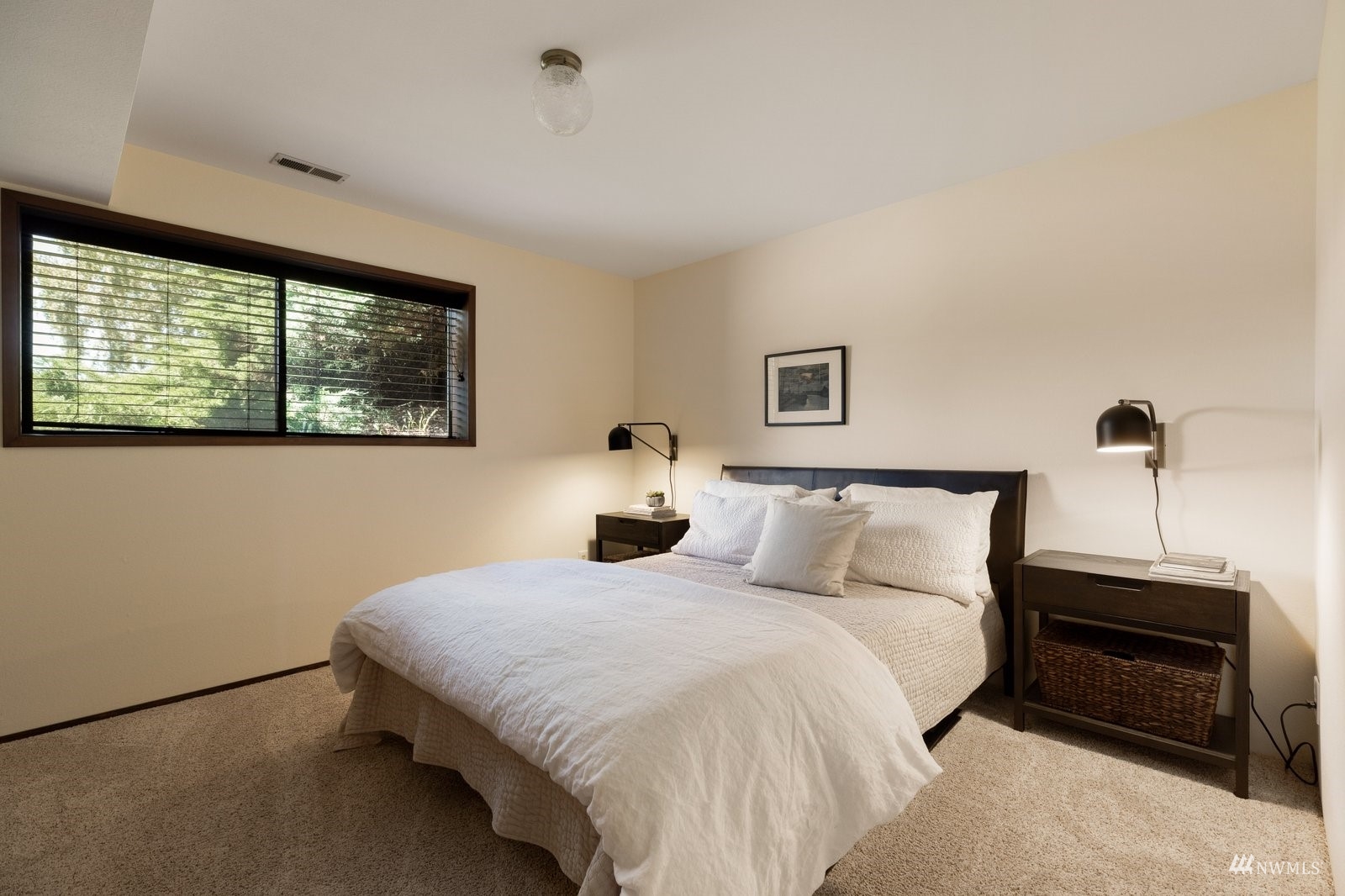 495 East Crescent Harbor Road Oak Harbor, WA 98277 - Photo 30 of 40 a bedroom with a bed and a window