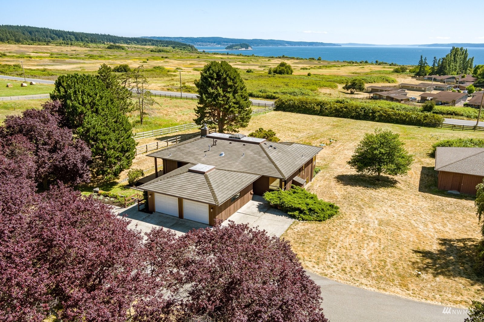 495 East Crescent Harbor Road Oak Harbor, WA 98277 - Photo 3 of 40 a view of an ocean and beach