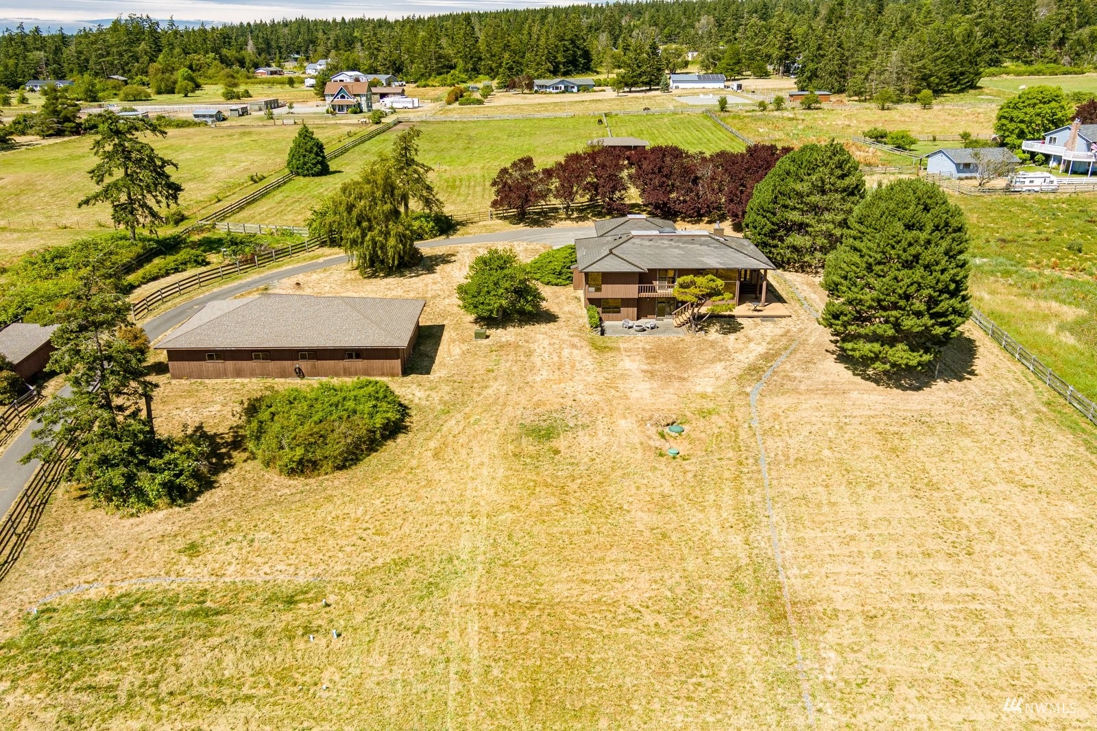 495 East Crescent Harbor Road Oak Harbor, WA 98277 - Photo 37 of 40 an aerial view of residential houses with outdoor space