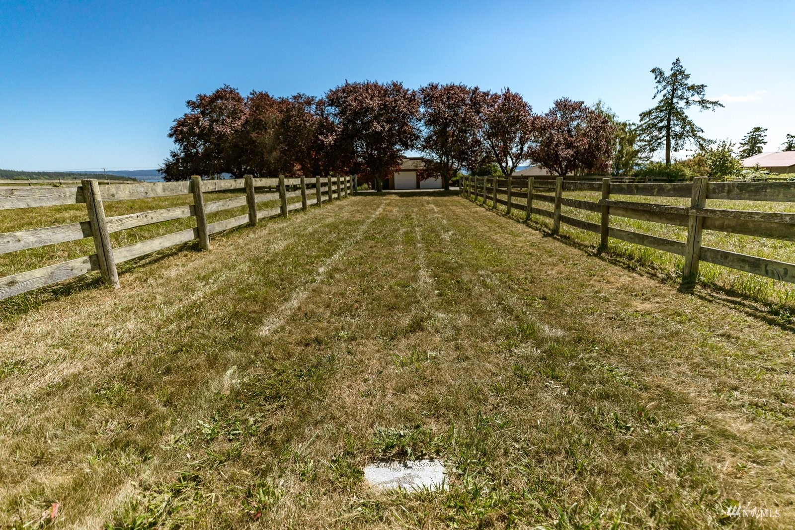 495 East Crescent Harbor Road Oak Harbor, WA 98277 - Photo 39 of 40 a view of a yard with wooden fence