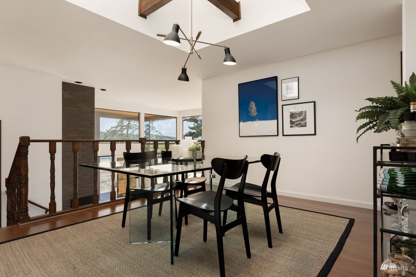 495 East Crescent Harbor Road Oak Harbor, WA 98277 - Photo 9 of 40 a view of a dining room with furniture and a potted plant