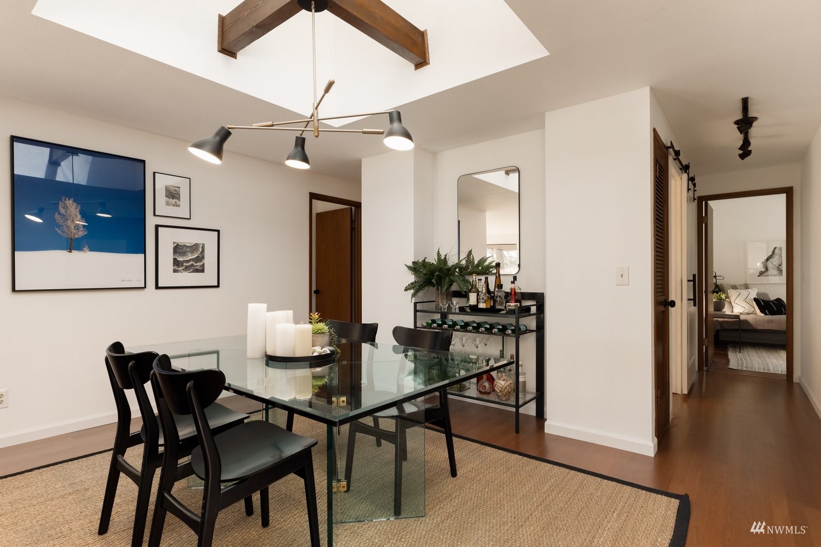 495 East Crescent Harbor Road Oak Harbor, WA 98277 - Photo 10 of 40 a view of a dining room with furniture and wooden floor