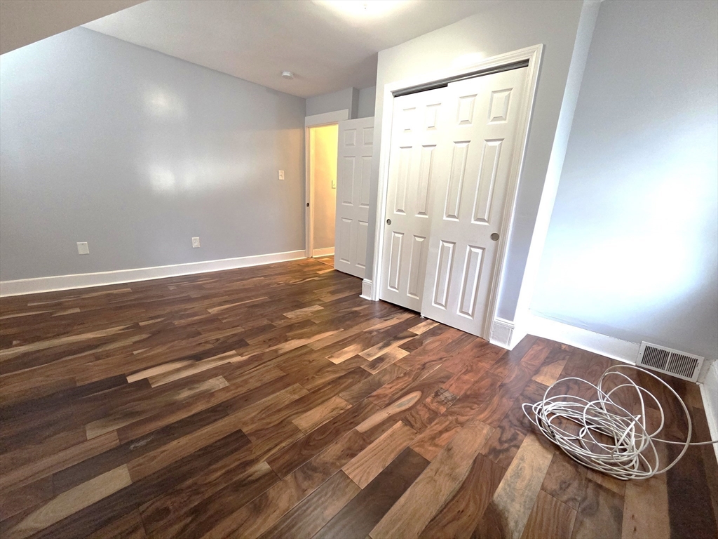 69 Pratt Street, Unit 1 Avon, MA 02322 - Photo 15 of 18 a view of a livingroom with wooden floor