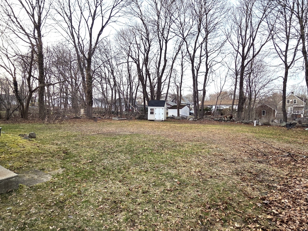 69 Pratt Street, Unit 1 Avon, MA 02322 - Photo 17 of 18 a view of a yard with a house