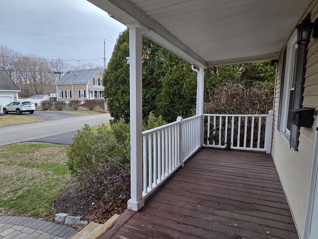 69 Pratt Street, Unit 1 Avon, MA 02322 - Photo 2 of 18 a view of a porch with wooden floor and outdoor space