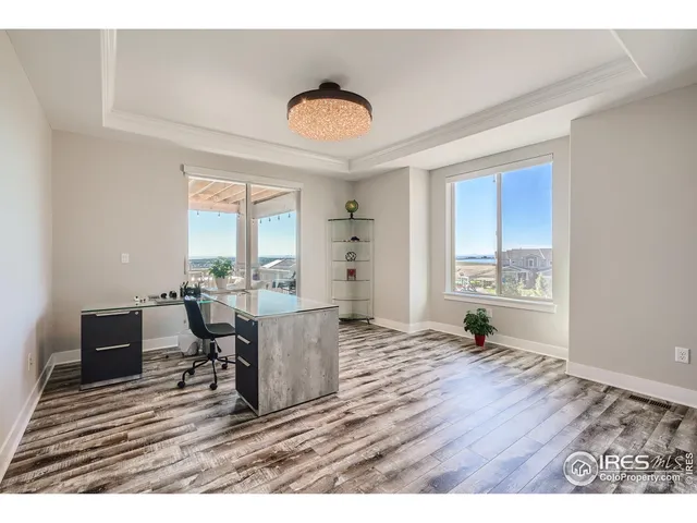 a bedroom with a bed window and a desk