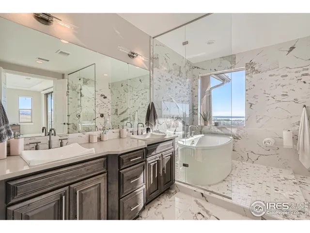 a bedroom with a bed a desk and chair