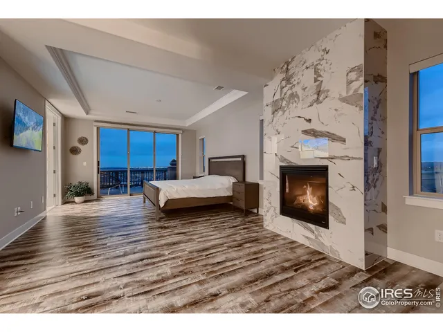 a bedroom with a bed and a fireplace