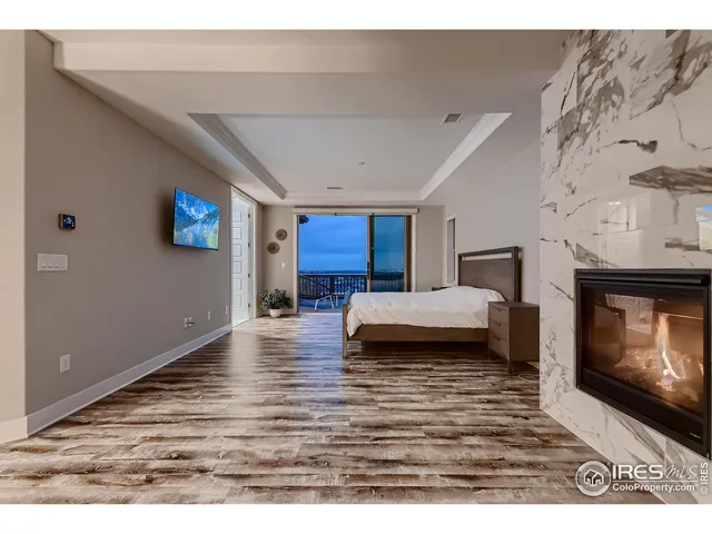 a view of sitting area with furniture on wooden floor