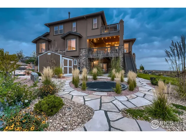 a view of a backyard with plants and a patio