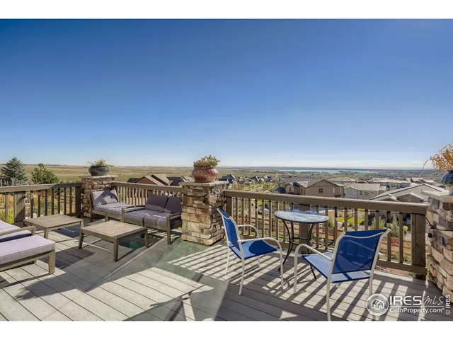 a view of a dining room with furniture and window