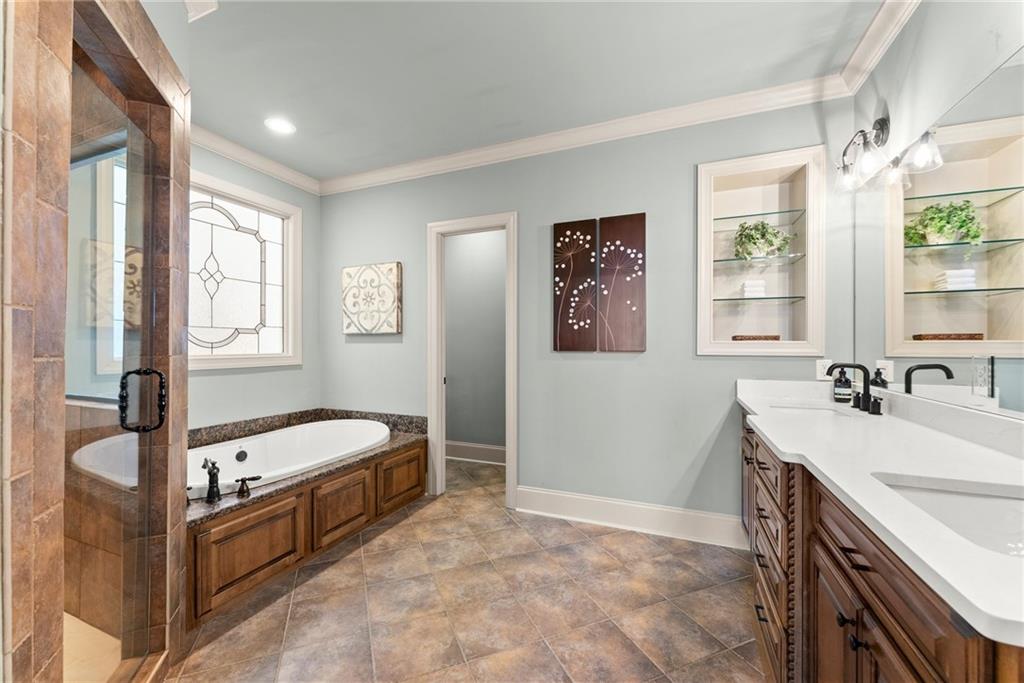 4529 Montclair Circle Gainesville, GA 30506 - Photo 12 of 35 a spacious bedroom with a bed and a window