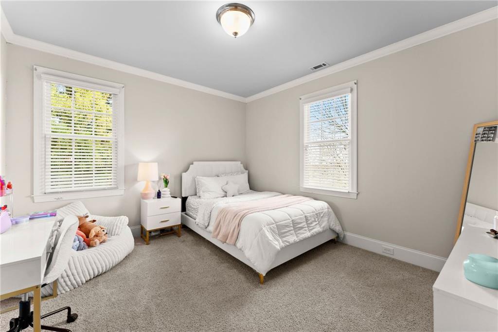 4529 Montclair Circle Gainesville, GA 30506 - Photo 16 of 35 a bedroom with bed and a window