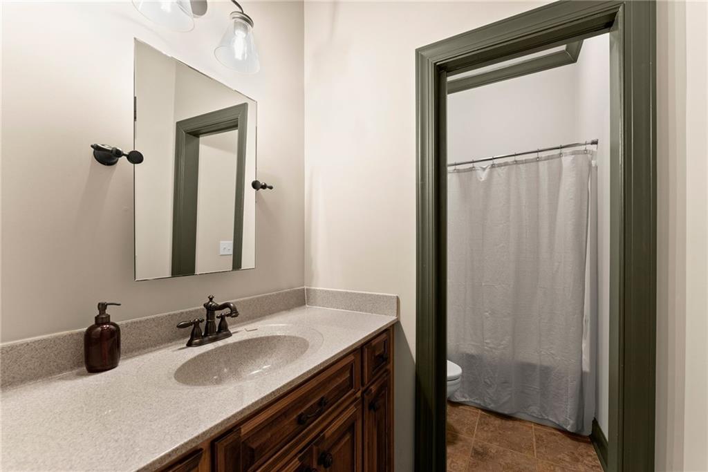 4529 Montclair Circle Gainesville, GA 30506 - Photo 20 of 35 a bathroom with a sink vanity and a mirror