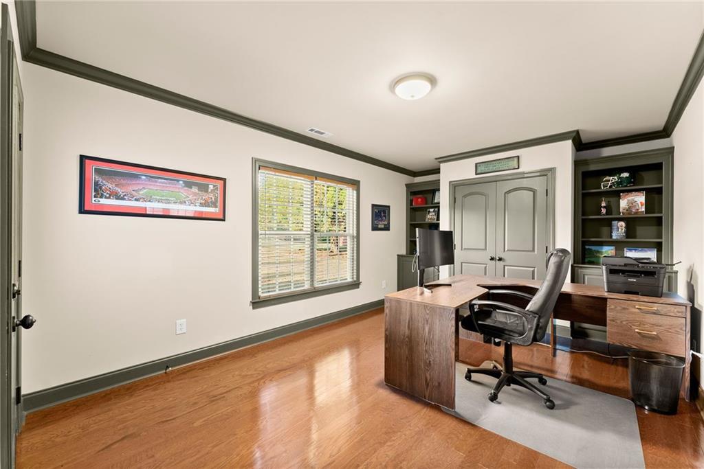 4529 Montclair Circle Gainesville, GA 30506 - Photo 22 of 35 a view of a workspace with furniture and a window