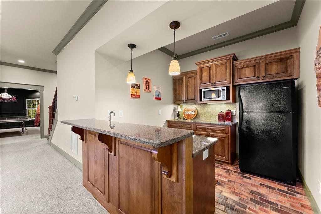 4529 Montclair Circle Gainesville, GA 30506 - Photo 24 of 35 a kitchen with stainless steel appliances granite countertop a refrigerator a sink and a stove