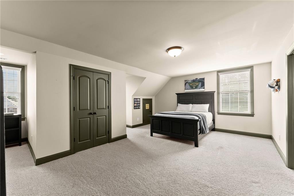 4529 Montclair Circle Gainesville, GA 30506 - Photo 25 of 35 a spacious bedroom with a bed and a window