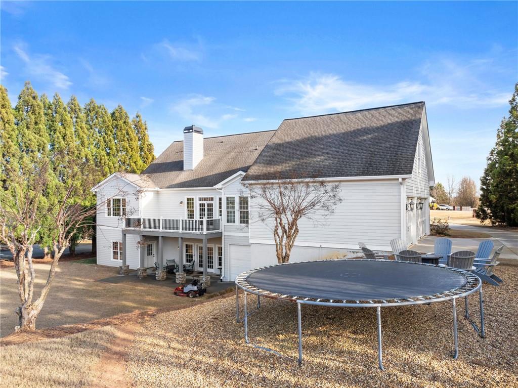 4529 Montclair Circle Gainesville, GA 30506 - Photo 29 of 35 a view of a house with backyard and sitting area